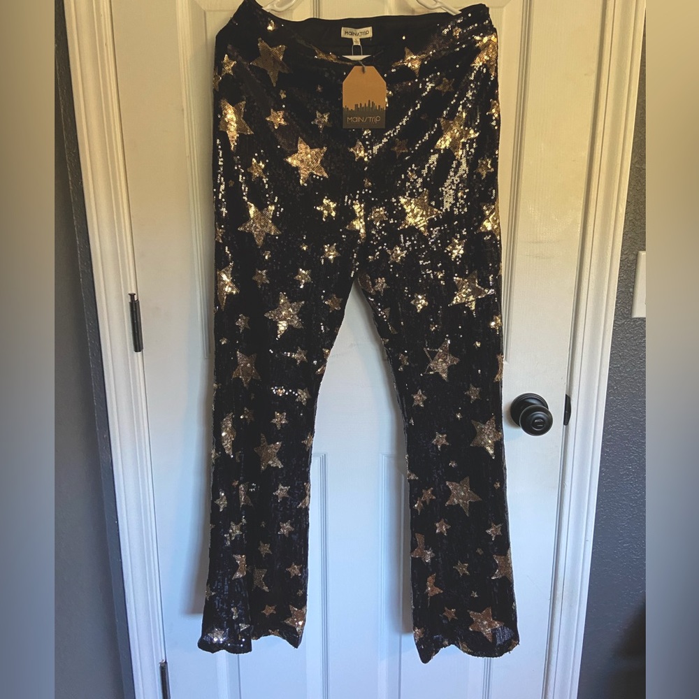 Brand new with tags blue and sliver sequin fully lined bell bottom pants.